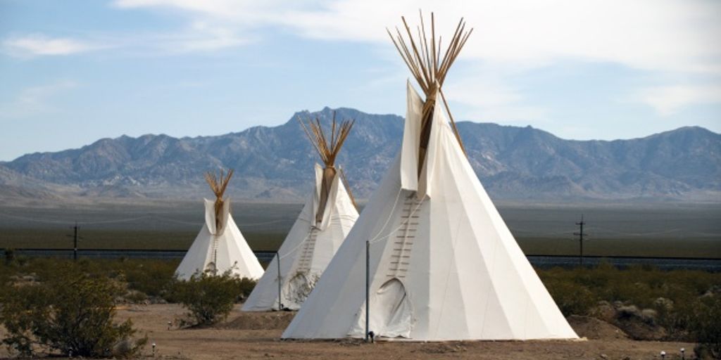 yurt and tepee in natural setting