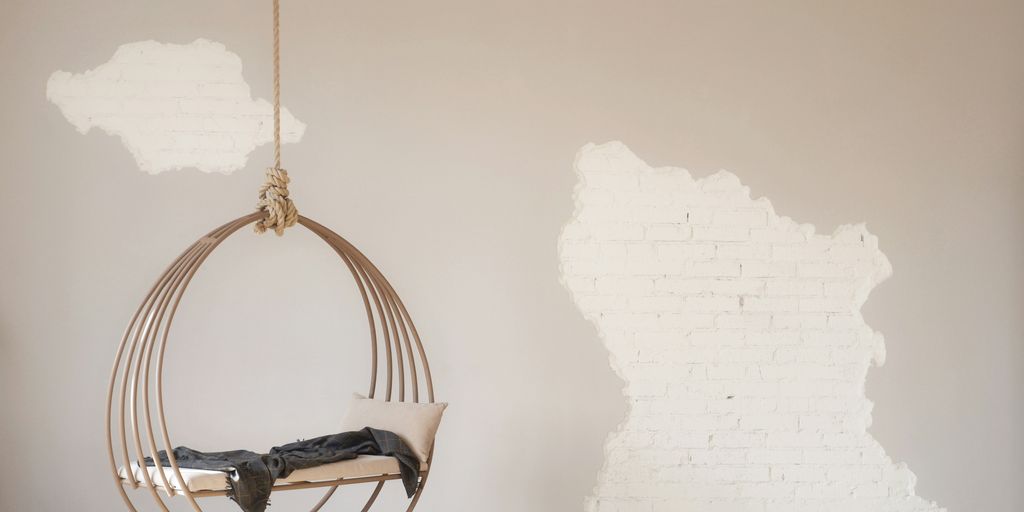 white hanging bench with stainless steel base