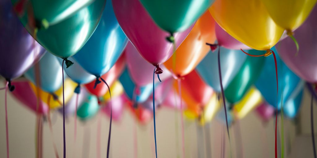 selective focus photography of assorted-color balloons